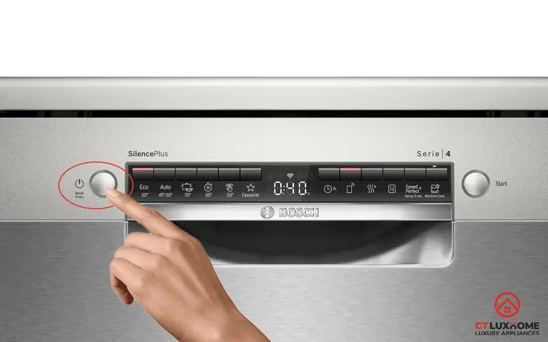 Thao tác giữ nút Reset trong 3 giây để hủy hoặc đổi chương trình rửa