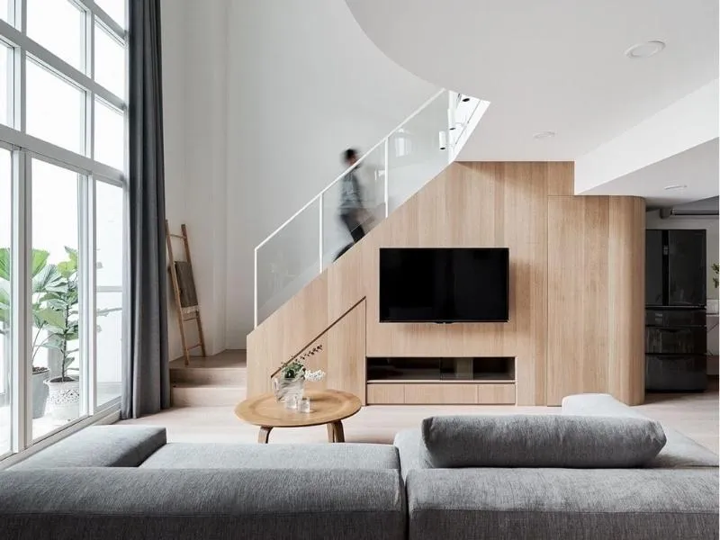Ưu tiên kệ tivi gầm cầu thang làm từ chất liệu gỗ, biểu trưng cho sự sinh sôi và phát triển
